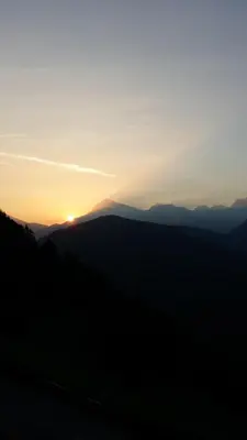 a sunset in the mountains with the sun setting at Lüch da Börz in Antermoia