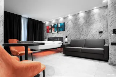 a living room with a couch and a table at ADV HOME - Exclusive Rooms in Bolzano