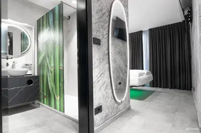 a bathroom with a sink and a mirror at ADV HOME - Exclusive Rooms in Bolzano