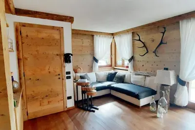 a living room with a couch and a window at 3BDRM Luxury Magic Flat near Cortina with Garage in Villanova
