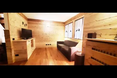 a living room with a couch and a television at 3BDRM Luxury Magic Flat near Cortina with Garage in Villanova