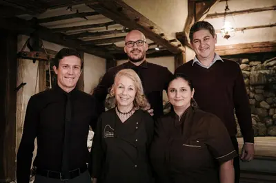 a group of people posing for a picture at Dorfhotel Beludei in Santa Cristina in Val Gardena