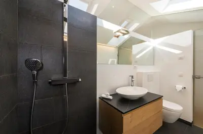 a bathroom with a sink and a shower at Chalet Merangardenvilla in Merano