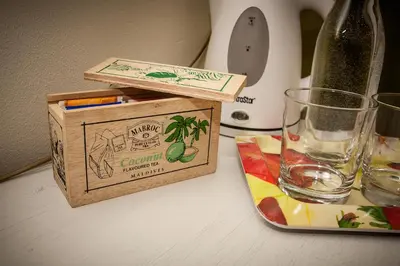 a bottle of wine and a glass on a table at B&B Incanto in Cles