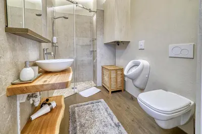 a bathroom with a sink and a toilet at Apartment Heinz in Merano