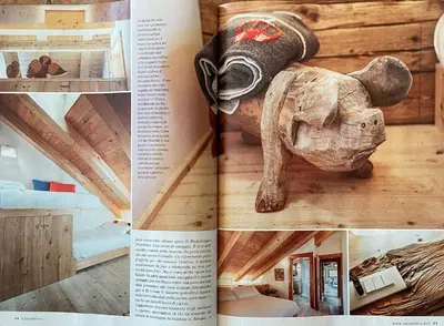 a page of a book with a picture of a house at Cà Bianca delle Dolomiti in Cortina dʼAmpezzo