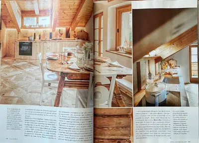 an article in a magazine showing a kitchen and a dining room at Cà Bianca delle Dolomiti in Cortina dʼAmpezzo