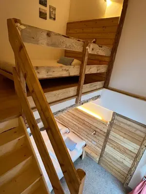 an overhead view of a bunk bed in a room at Locanda al Toal in Moena