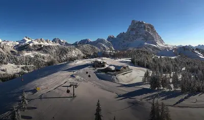 an aerial view of a ski resort with a mountain at Mezzodi in Mareson