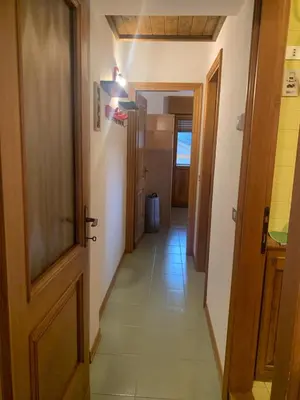 a hallway with an open door and a hallwayngth at Mezzodi in Mareson