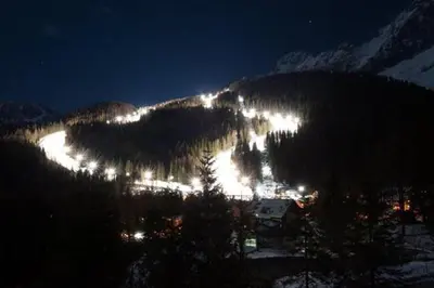 a view of a mountain at night with lights at Mezzodi in Mareson