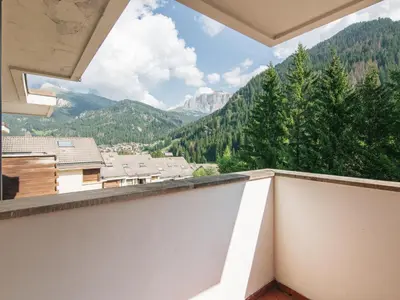 a balcony with a view of the mountains at Apartment Enrosadira-11 by Interhome in Alba di Canazei