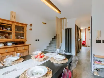 a kitchen with a table with plates on it at Apartment Family House by Interhome in Moena