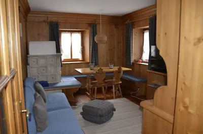 a living room with a table and a dining room at Apartment with three bedrooms and garden in Chiave in Chiave
