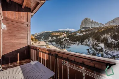 a balcony with a view of the mountains at HOTIDAY Apartment Collection - Santa Cristina in Santa Cristina in Val Gardena