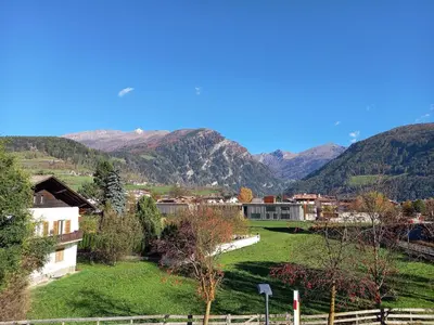 a small village with mountains in the background at Apartment Weiss-Spitz in Vipiteno