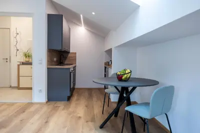 a kitchen and dining room with a table and chairs at Apartment Weiss-Spitz in Vipiteno