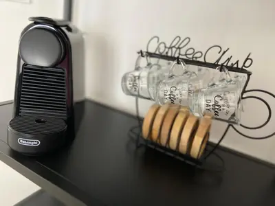 a black table with a toaster and some bread at Luis Home in Laives