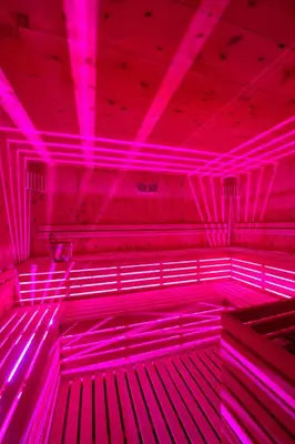 a room with pink lights on the ceiling at Golden Park Resort in Campitello di Fassa
