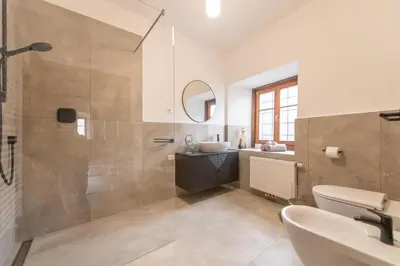 a bathroom with a sink and a mirror at Gösslturm in Lana