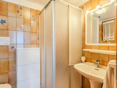 a bathroom with a shower and a sink at Apartment Ermeti by Interhome in Sfruz
