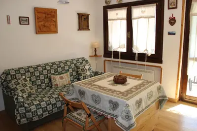 a living room with a couch and a table at Residence Fontanazzo in Campitello