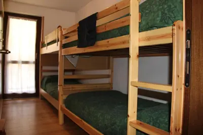 a couple of bunk beds in a room at Residence Fontanazzo in Campitello