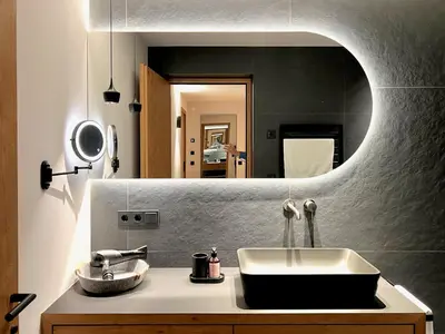 a bathroom with a sink and a mirror at Egger 5 in Sorafurcia