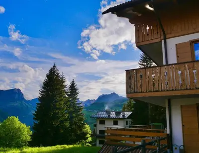 a view of the mountains from the balcony of a house at Climb house Geremia in Selva di Cadore