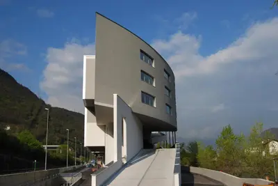 a white building on the side of a road at Die Bücherstube im living Kampill in Bolzano