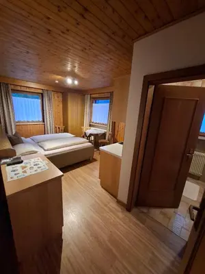 a large room with a bed and a couch at Appartement Alpenblick in Valdaora