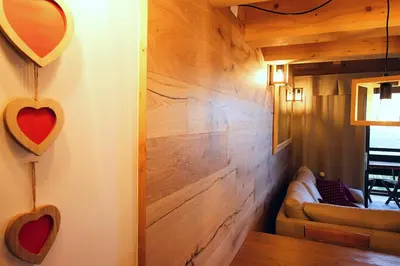 a bathroom with a sink and a toilet and a mirror at SKYWAY LOFT - Residence Veronza con piscina, Dolomiti Affitti in Cavalese