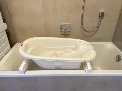 a white bath tub in a bathroom with a shower at Appartamento Adele in Merano