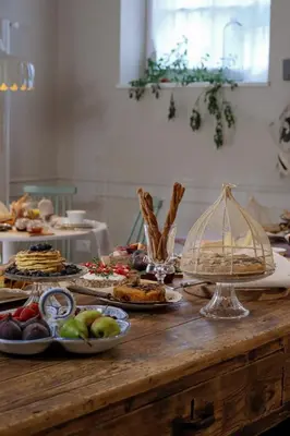 a table with many different types of food on it at Casa Fellin 1891 B&B in Cles