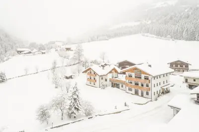 an aerial view of a village in the snow at Penthouse Zirm Untermairhof in Selva dei Molini