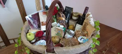 a basket filled with food on top of a table at Hilburgerhof in Schenna