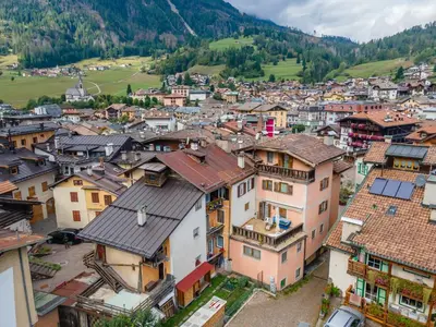 an aerial view of a town in the mountains at Casa del Batesta in Moena