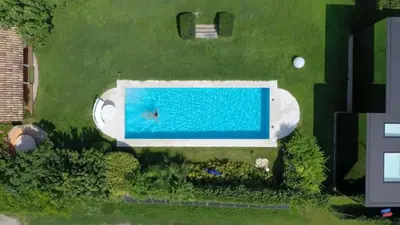 an overhead view of a swimming pool in a yard at Mirror Houses in Bolzano