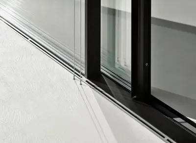 a window on the side of a building at Mirror Houses in Bolzano