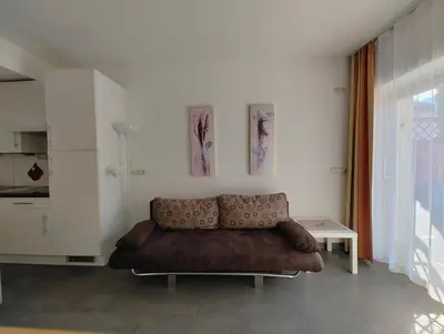 a living room with a couch and a table at Apartment Mair in Valdaora