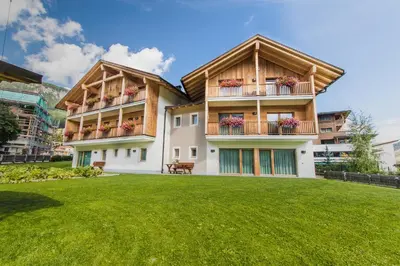 a house with a lawn in front of it at Apt Bel Pre in La Villa