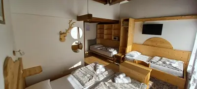 an overhead view of a room with three beds at Hotel Salgetti in Mezzano