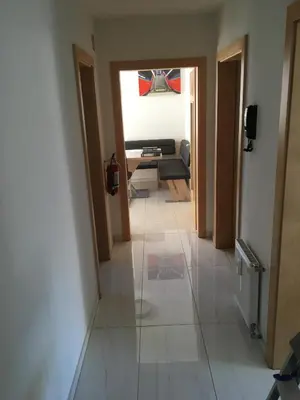 a hallway with a view of a living room at V91 Young People Citymountain in Brunico