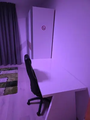 a white desk with a black chair in a room at V91 Young People Citymountain in Brunico