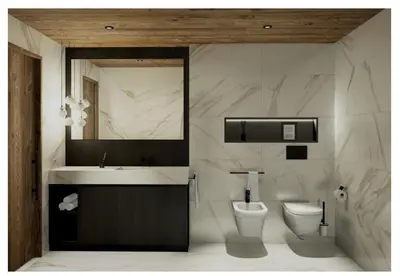 a bathroom with a sink and a toilet at Apartments Clivus in Corvara in Badia