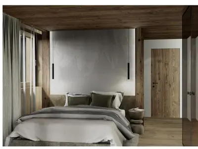 a bedroom with a large bed with a wooden headboard at Apartments Clivus in Corvara in Badia