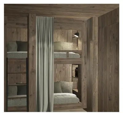 a room with two bunk beds and a mirror at Apartments Clivus in Corvara in Badia