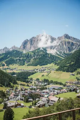 a town in a valley with a mountain at Apartments Clivus in Corvara in Badia