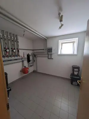 an empty room with a gym with a window at Comodità in centro a Tesero in Tesero