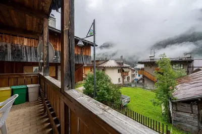 a view from a balcony with a view of a city at Cesa de Piè in Canazei